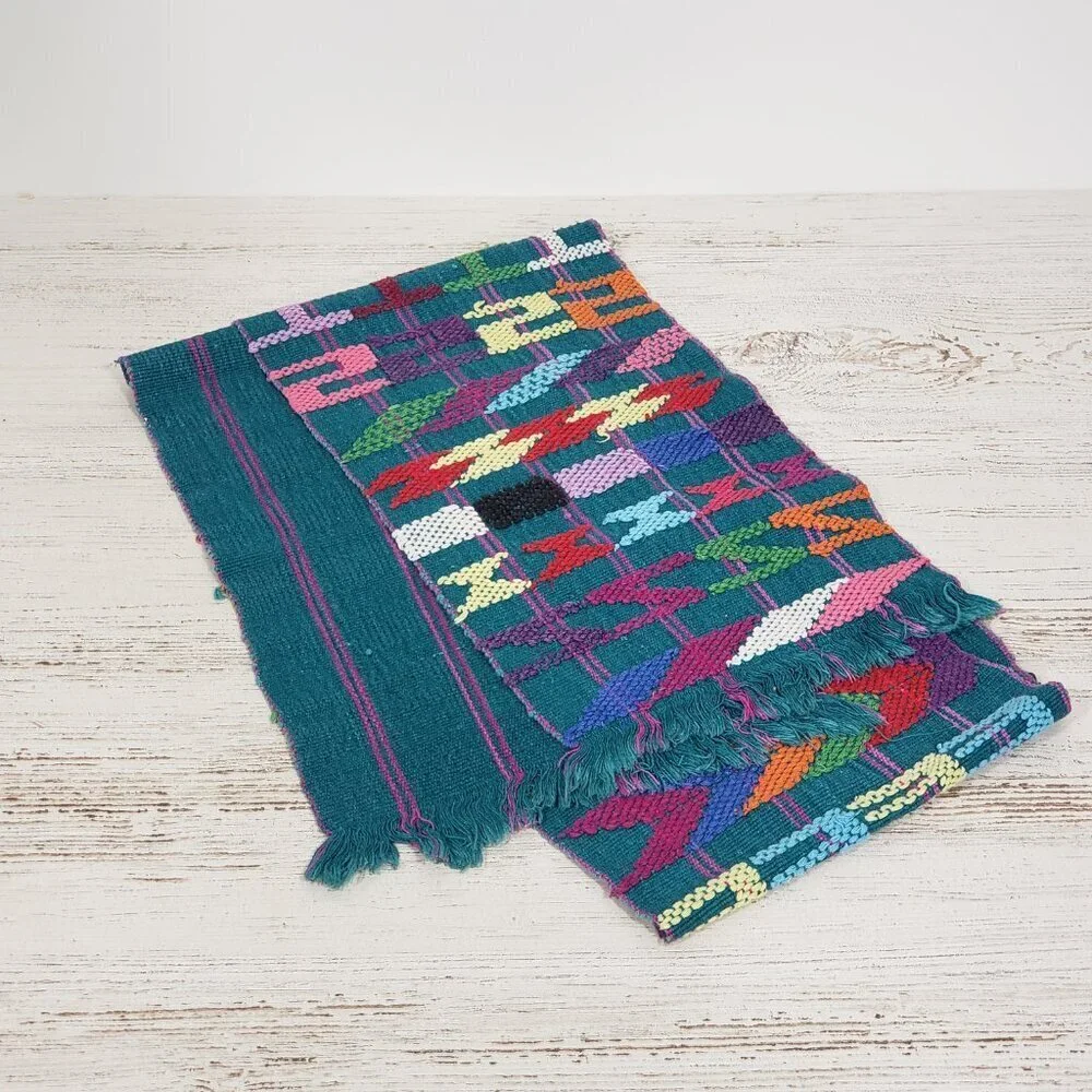 Handwoven Colorful Table Runner Teal background with lots of other colors